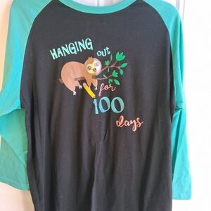 Luxury JLT Black Tee with Teal Trim and Playful Graphic